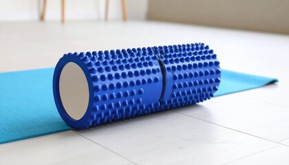 Blue Foam Roller On Exercise Mat