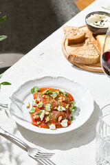 Baked peppers with feta and pesto, bright daylight, overhead composition for contemporary menu...