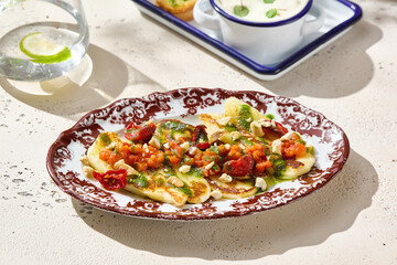 Grilled halloumi with tomato salsa, bright natural light, overhead composition