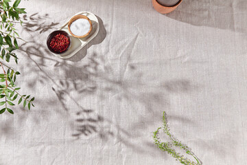Linen tablecloth with spices, bright lighting, overhead composition with negative space