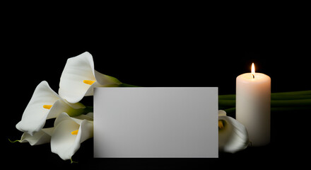 Elegant remembrance scene featuring calla lilies, candle and blank card on dark background