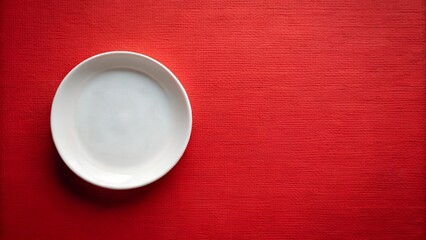 Empty White Plate on Red Textured Background