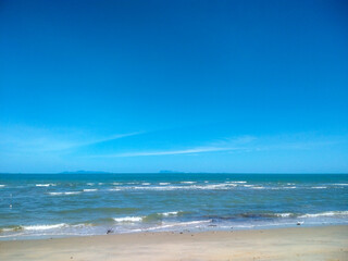 Scenic Sandy Beach with Blue Sky and White Clouds at Nathon Beach, Koh Samui, Thailand