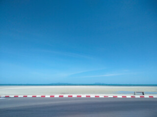 Fototapeta premium Asphalt Road Along Nathon Beach with Blue Sky and Cloud Background, Koh Samui, Thailand
