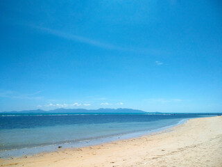 Fototapeta premium Scenic Sandy Beach with Blue Sky and White Clouds at Nathon Beach, Koh Samui, Thailand