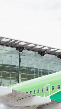 Drone carrying a box in an airport