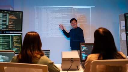 Asian software engineer or programmer team working late in development office,problem solving or...