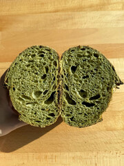 Matcha sourdough loaf sliced to expose crumb.