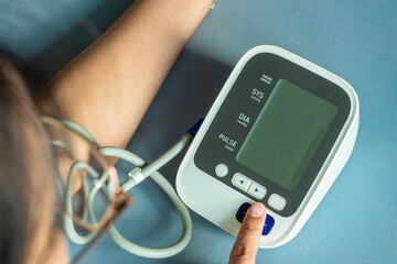 Man check blood pressure monitor and heart rate monitor with digital pressure gauge. Health care...