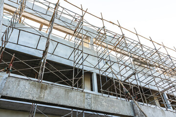 Bamboo scaffoldings at under construction building for high risk workers in site