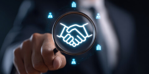 Trusted partner. Trustworthy collaboration, company or contract. Confidence to work together. Businessman use Magnifying glass finding shake hand icon. Build trust in business finance relationships.