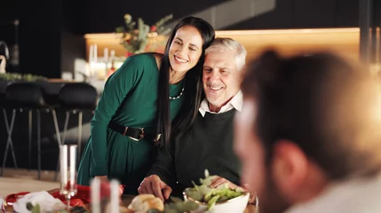 Fotobehang Hug, Christmas and woman with senior father for vacation dinner, bonding and excited. December, holiday or festive surprise with family, food and celebration with smile and social gathering in home © peopleimages.com