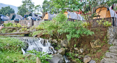 tropical riverside camping view, puncak mas, west java, indonesia
