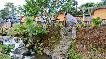 tropical riverside camping view, puncak mas, west java, indonesia
