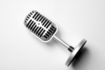 Vintage silver microphone with a white background. Top view