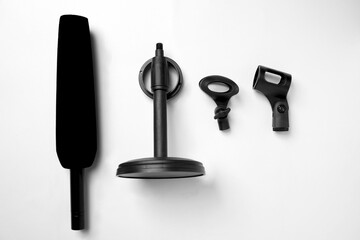 Studio microphone for podcasting or streaming with a set of mic stands on a white background. Top view