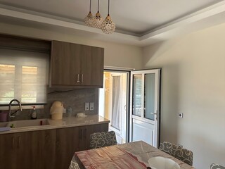 Modern Kitchen Interior with Open Balcony Door