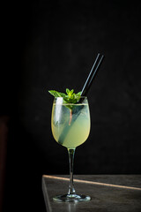 A mint cocktail brings elegance to the rustic setting with its fresh allure