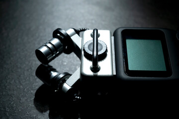 Handy recorder device on a black background