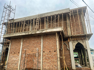 Mosque is rising through sincere hands. Though it still shows raw bricks and bamboo, the effort...