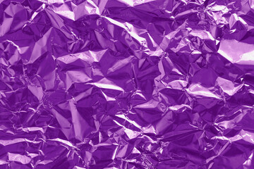 Purple foil texture background, pattern of wrapping paper with crumpled and wavy.