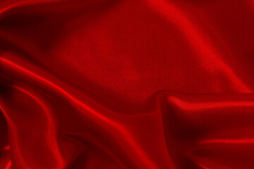 Dark red fabric texture background, detail of silk or linen pattern.