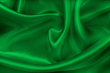 Green emerald fabric texture background, detail of silk or linen pattern.
