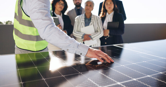 Hand, solar panel and engineer with business people outdoor for photovoltaic, property and project. Technician prototype, realtor developer and group with power grid for renewable energy cell - Powered by Adobe