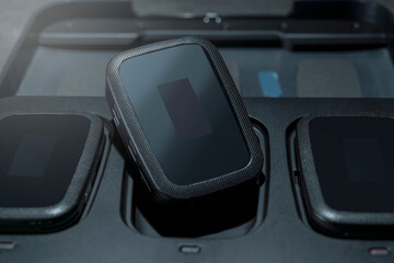 Clip on wireless microphone for interview or podcast equipment in the box on a black background