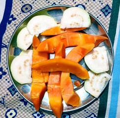 Fresh Sliced Papaya and Guava on Steel Plate