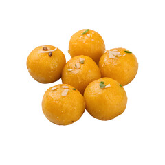 Delicious indian besan ladoo sweets garnished with nuts and herbs isolated on transparent background