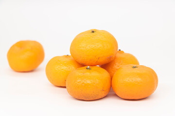 Citrus or tangerina and peeled fruit on white background,
