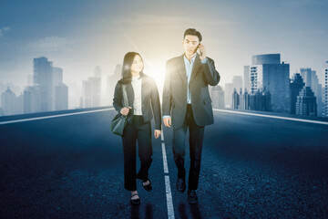 Business Professionals Walking on Urban Highway with City Skyline and Sunlight