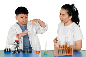 Asian Boy Doing Chemistry Experiment with Teacher Observing in Science Lab