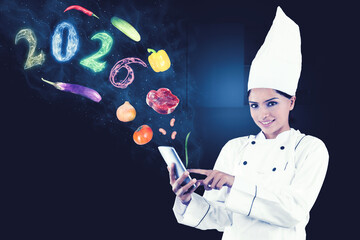 Chef Using Smartphone for 2026 Food Trends and Digital Cooking