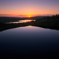 Fototapeta premium Serene Sunset Over Still Lake and Forest, Peaceful Twilight Landscape Photography