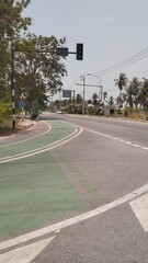 Empty Road with Marked Bike Path and Clear Sky for Sustainable Travel