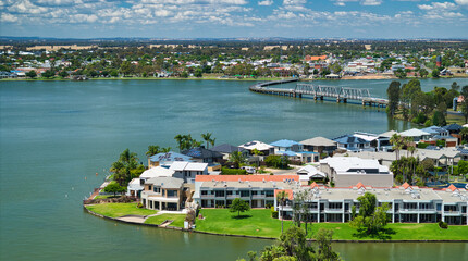 Modern holiday luxury accommodation with the sweeping road bridge beyond