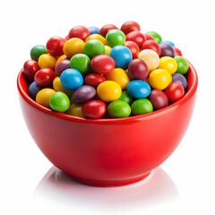 pile of colorful candies in red bowl on white background