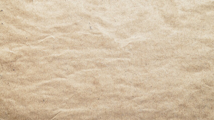 Old worn crumpled paper background. Vintage dirty sheet of parchment