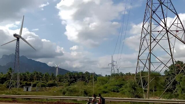 Short motion video showcasing a single windmill rotating in nature.