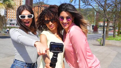 Cheerful friends vlogging urban adventures