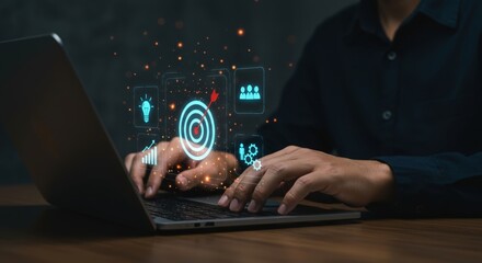Businessman utilizing a laptop with a digital interface displaying business goals strategy and team collaboration icons with glowing particles