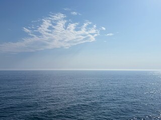 Calm ocean and cloud in the blue sky.