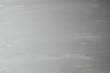 Gray textured surface with subtle brush strokes adding character and depth