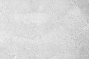 Gray textured plaster wall with abstract background