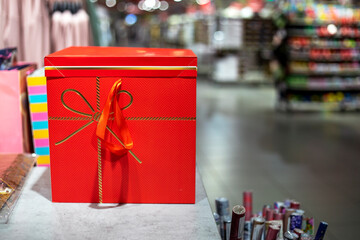 gift wrapped in a red large gift box. Boxing Day. preparing for the holiday