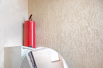 fire extinguisher in the corner of the classroom wall. safety and rules