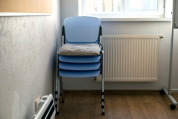 chairs stacked in a classroom. Back to school