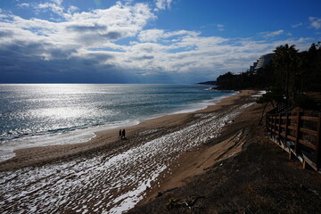 winter seascape with snow and walkway